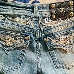 Miss Me Light Blue Boot Cut Jeans with Sequin-Embellished Back Pockets.